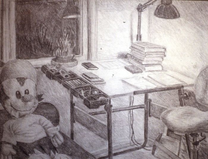 Pencil interior of a drafting desk beside a window