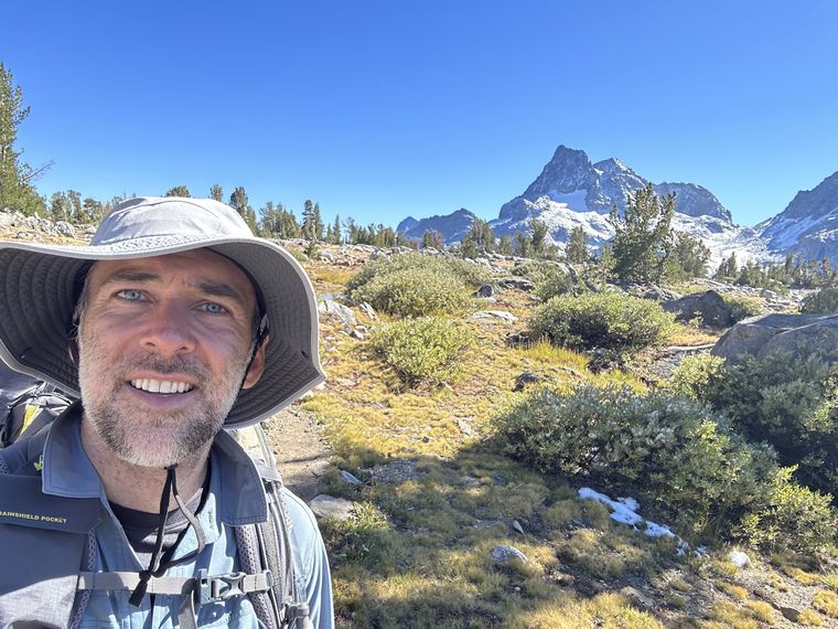 Scott Lerch backpacking from Tuolumne Meadows to Mammoth with Banner Peak behind, 2022